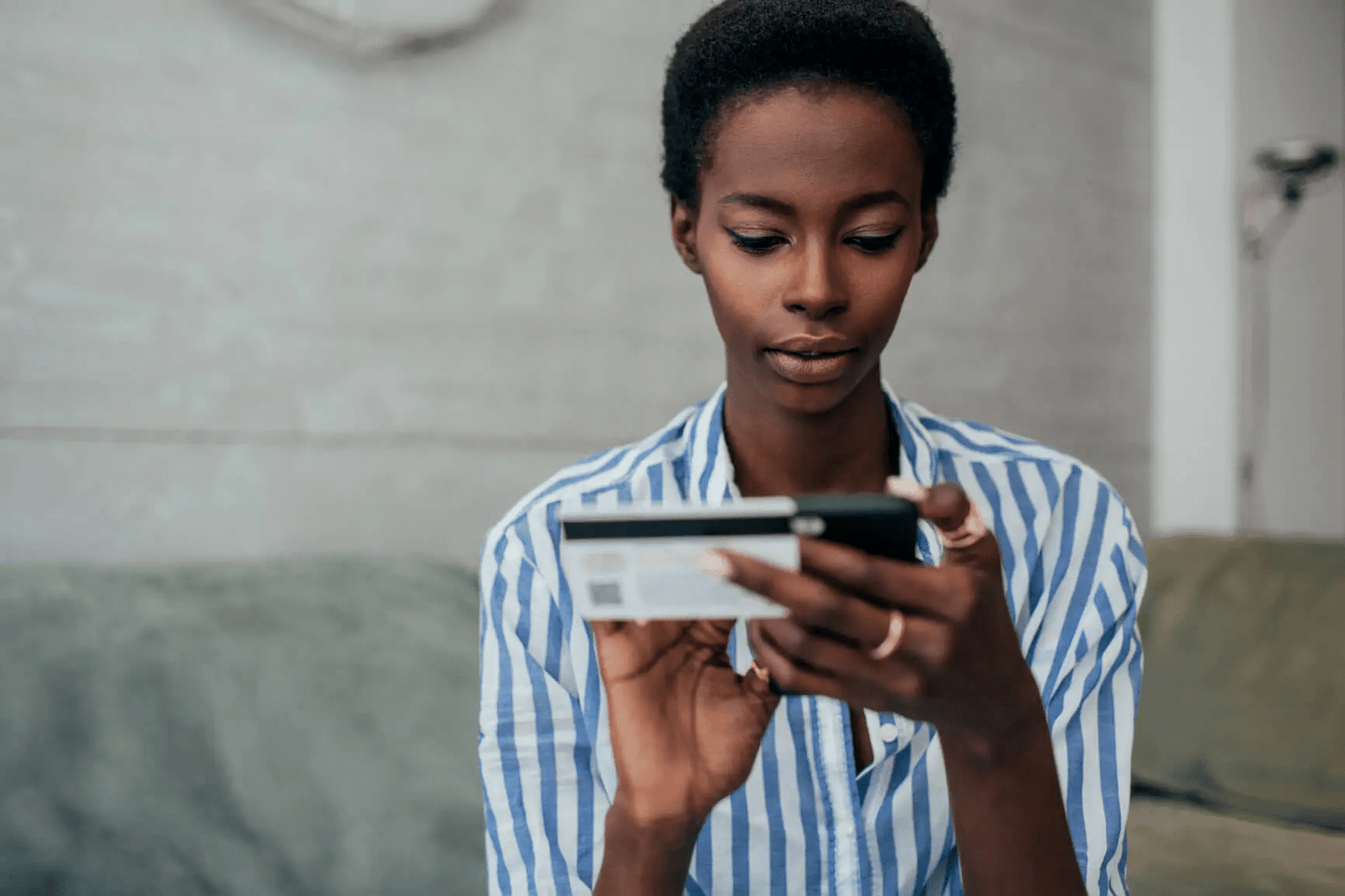 Woman holding phone ensuring her site is secure.