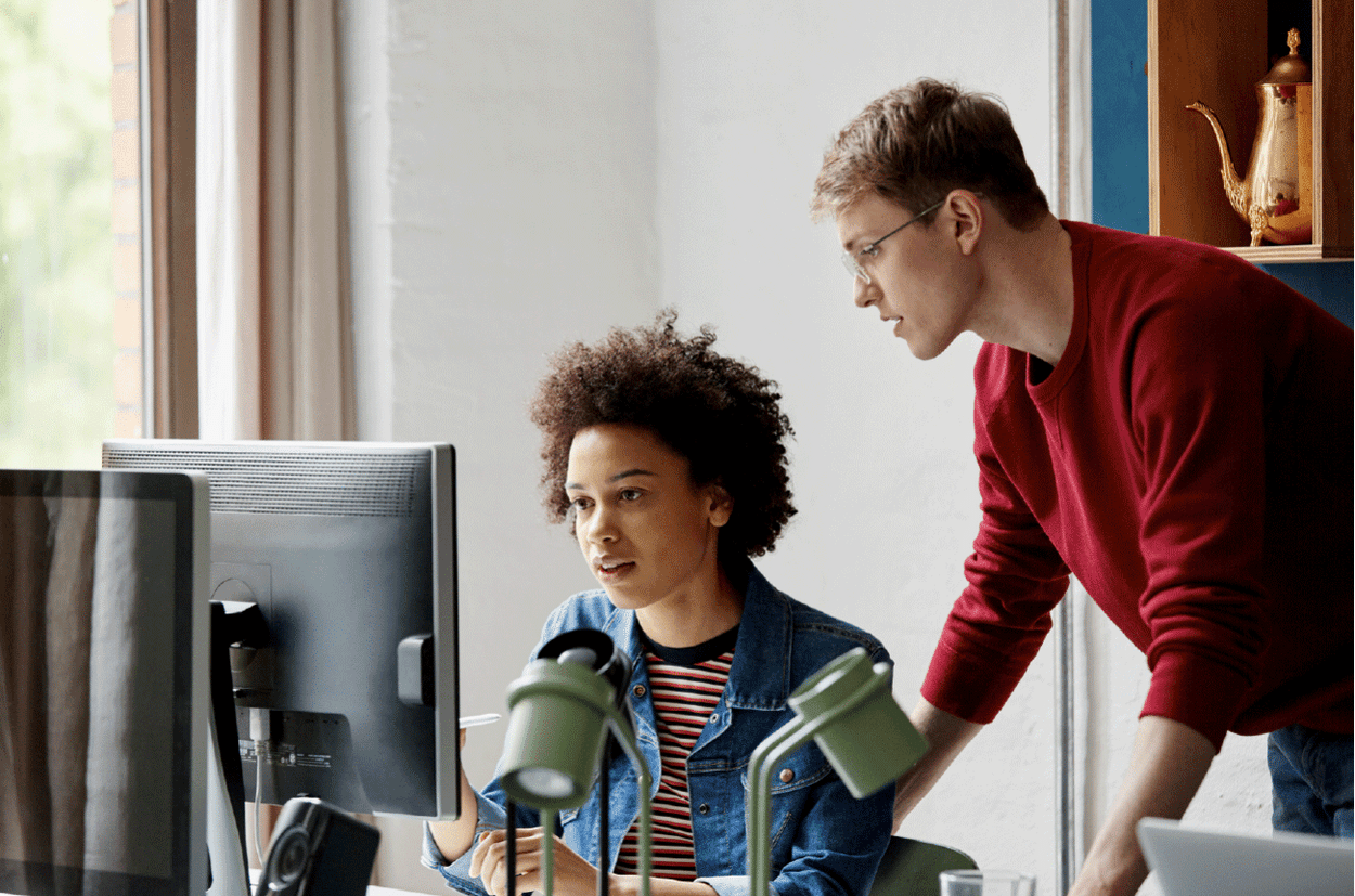 Two people working together in an office