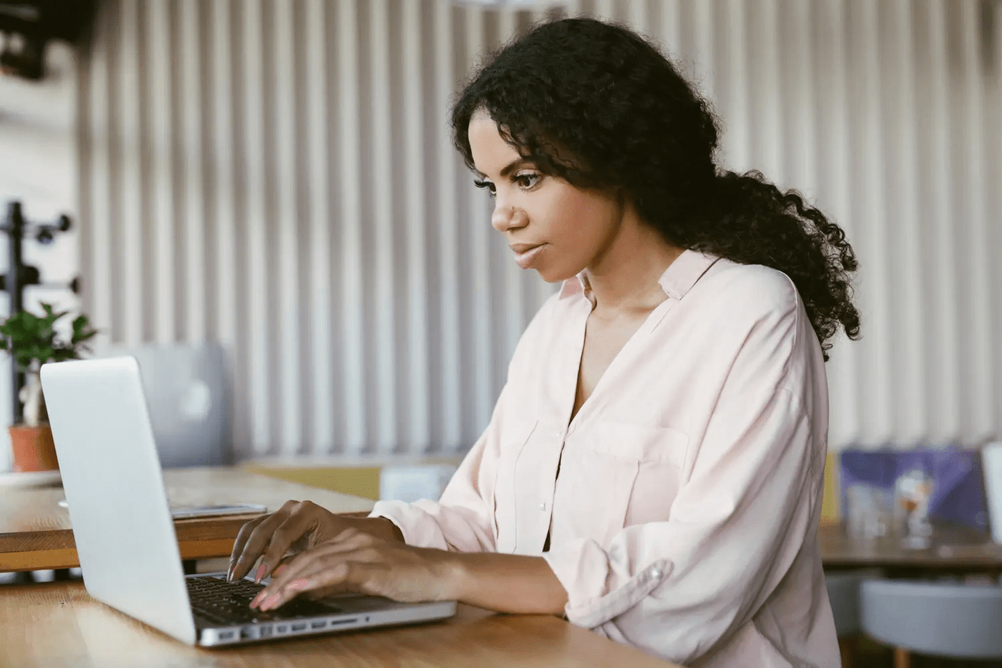 Woman typing on her laptop