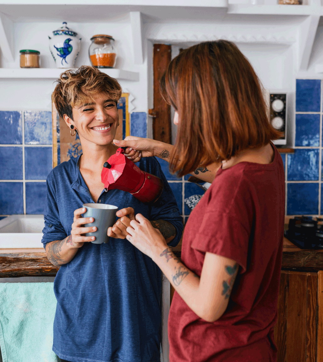 Female couple having coffee without worrying about their businesses