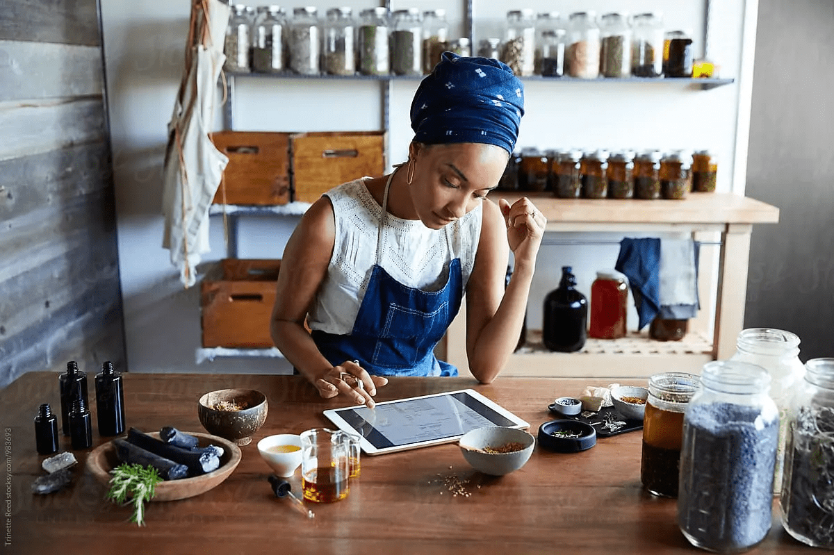 woman arranging plants thinking about choosing her perfect domain name