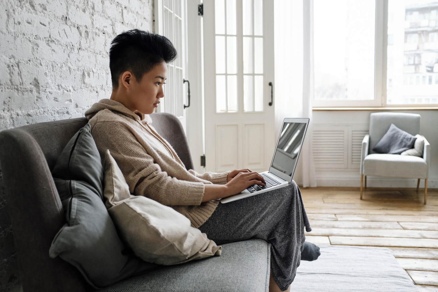 person typing on laptop