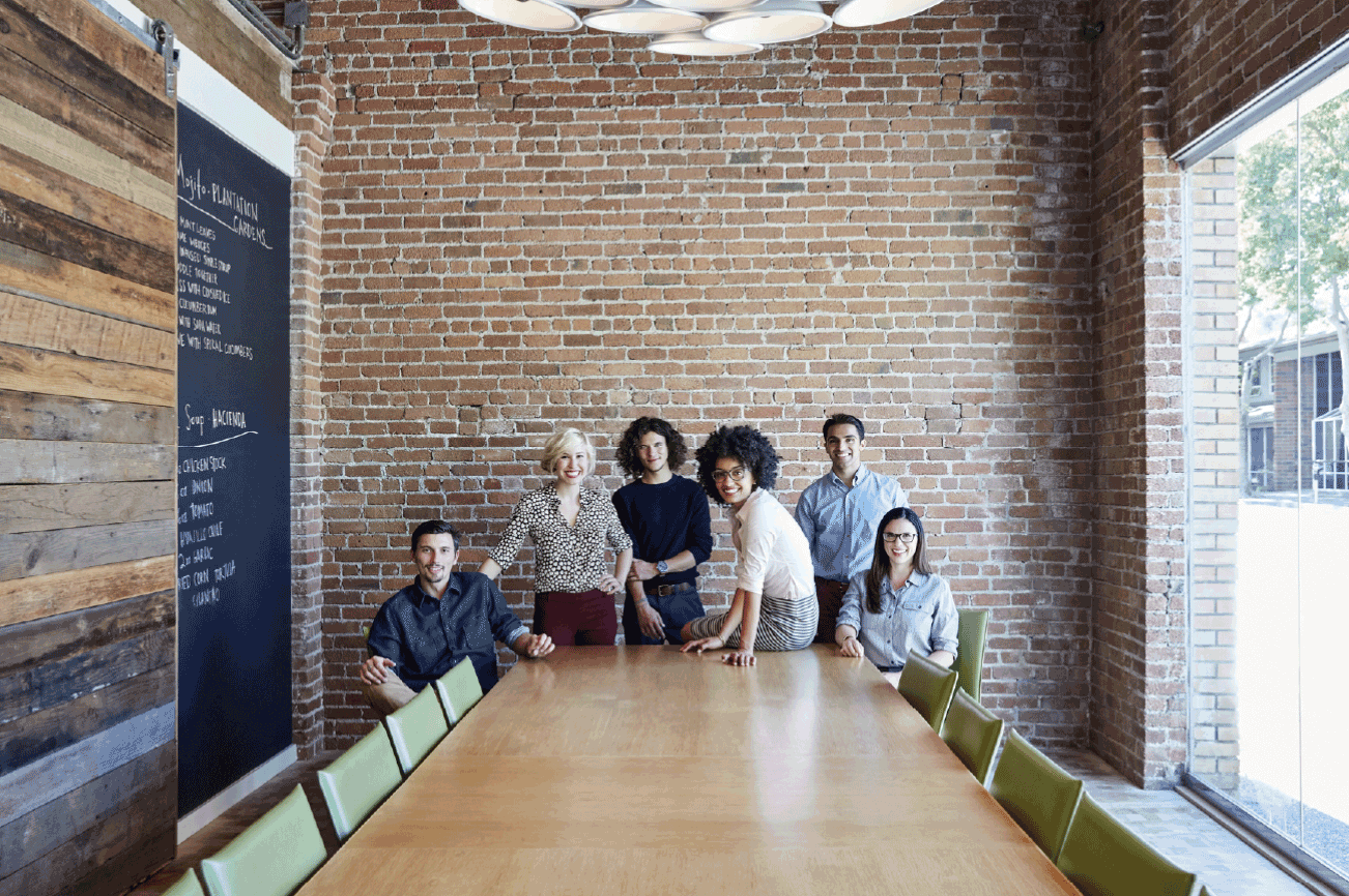 A group of people in a cool office board room