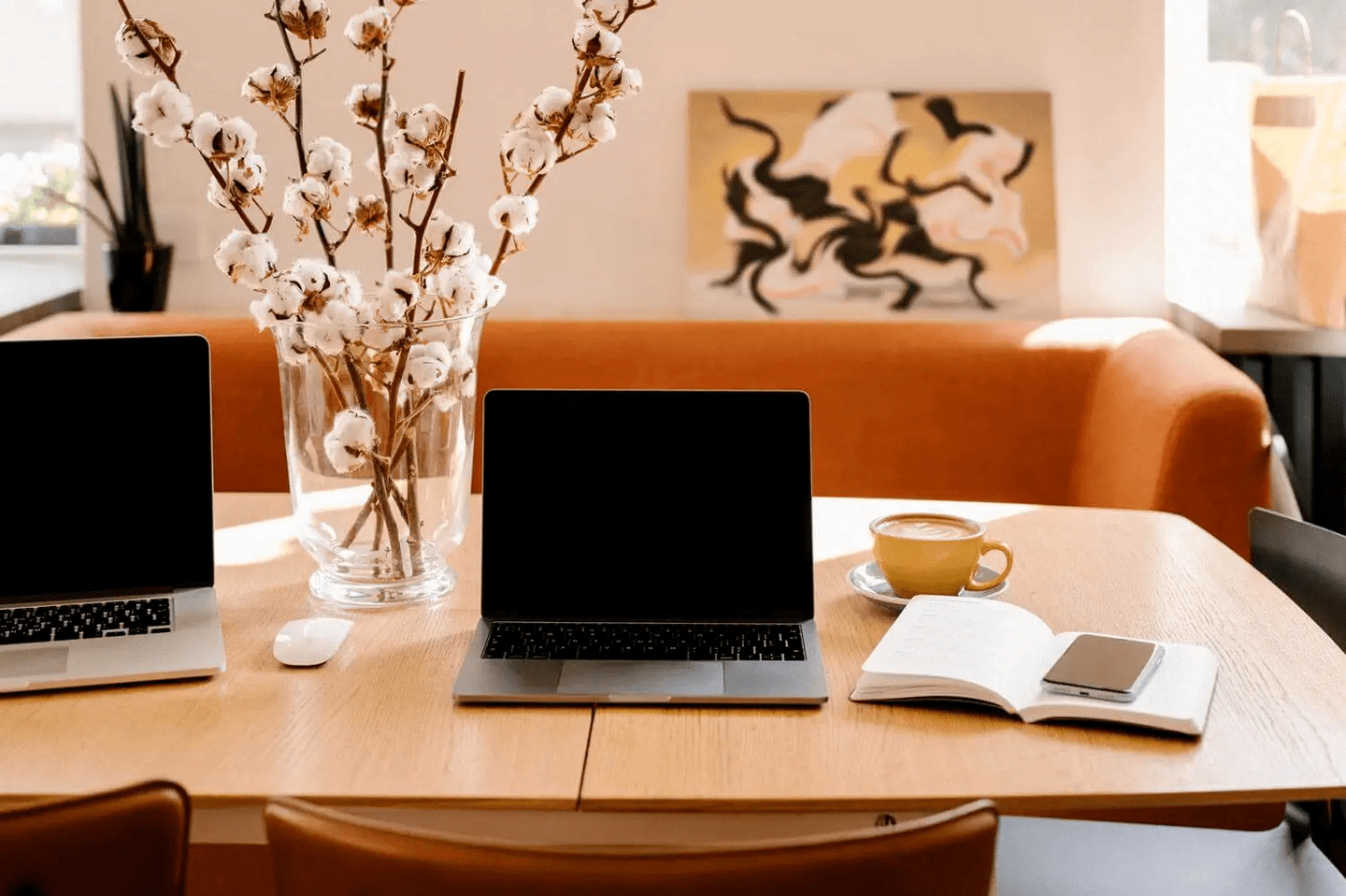 Laptops on a table at a cute cafe