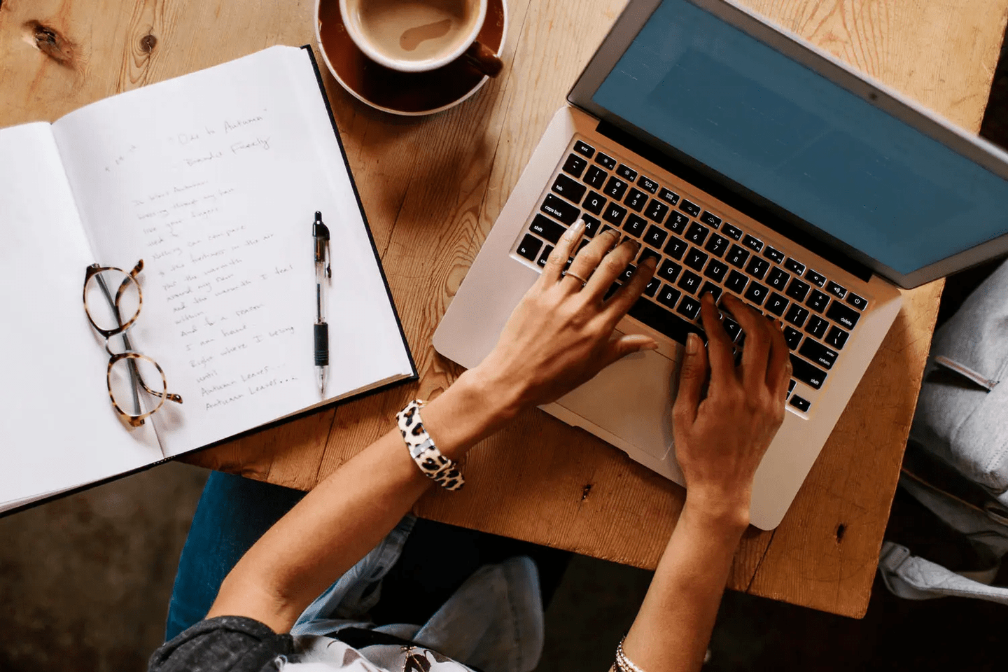 Woman with her hands on her keyboard composing an email 